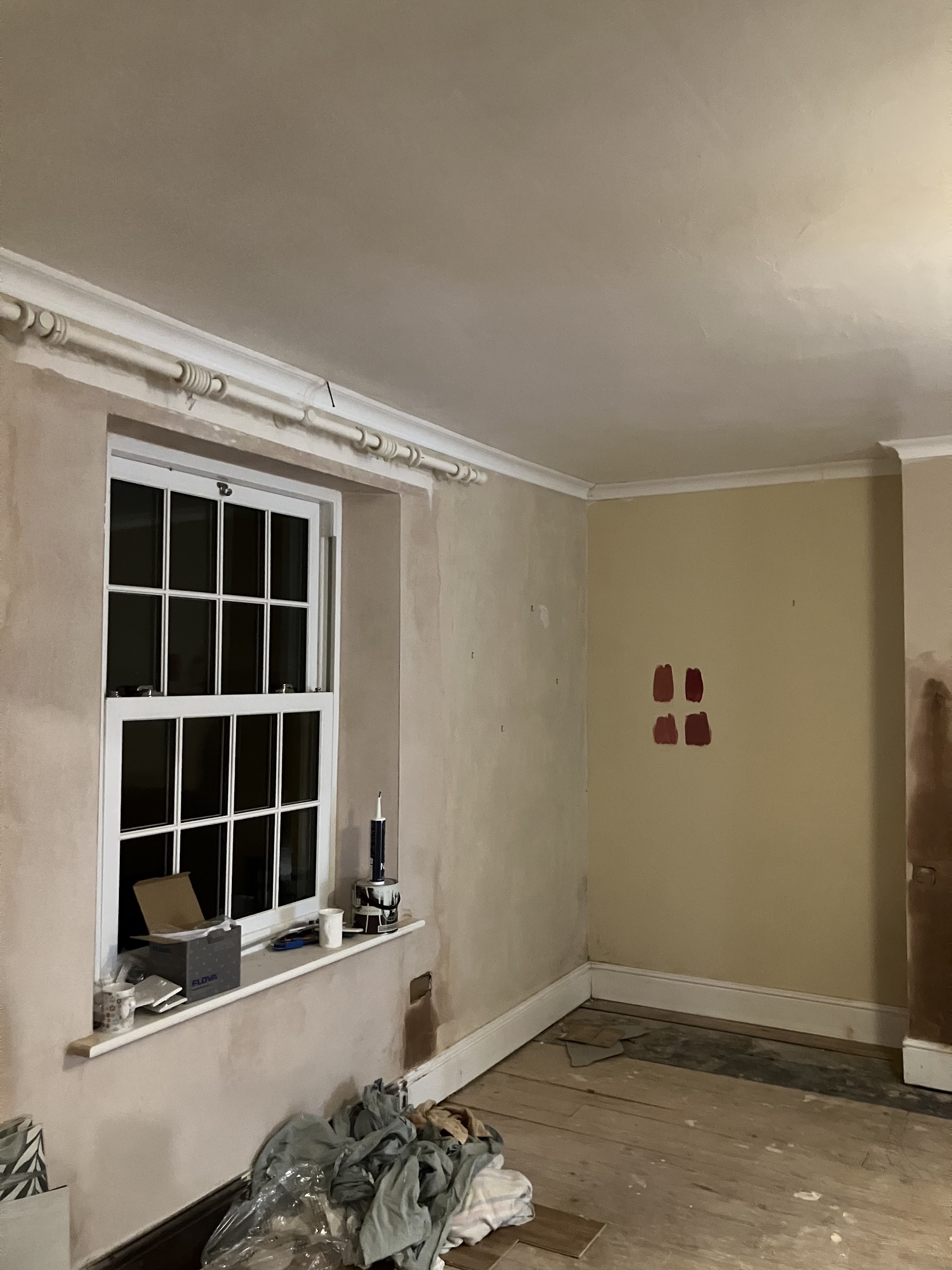 Room with walls filled and prepared around a sash window