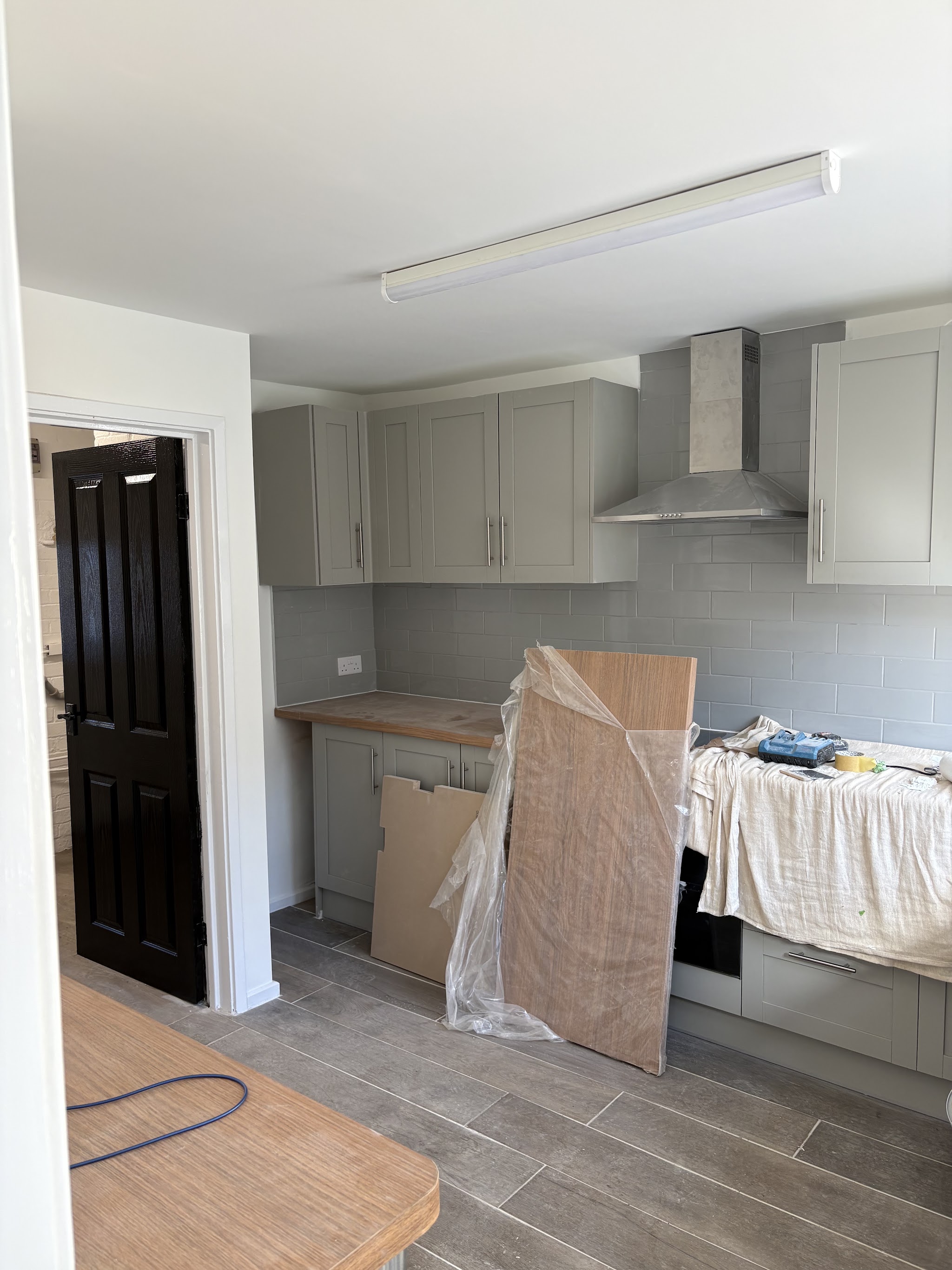Kitchen being decorated with units and worktops protected
